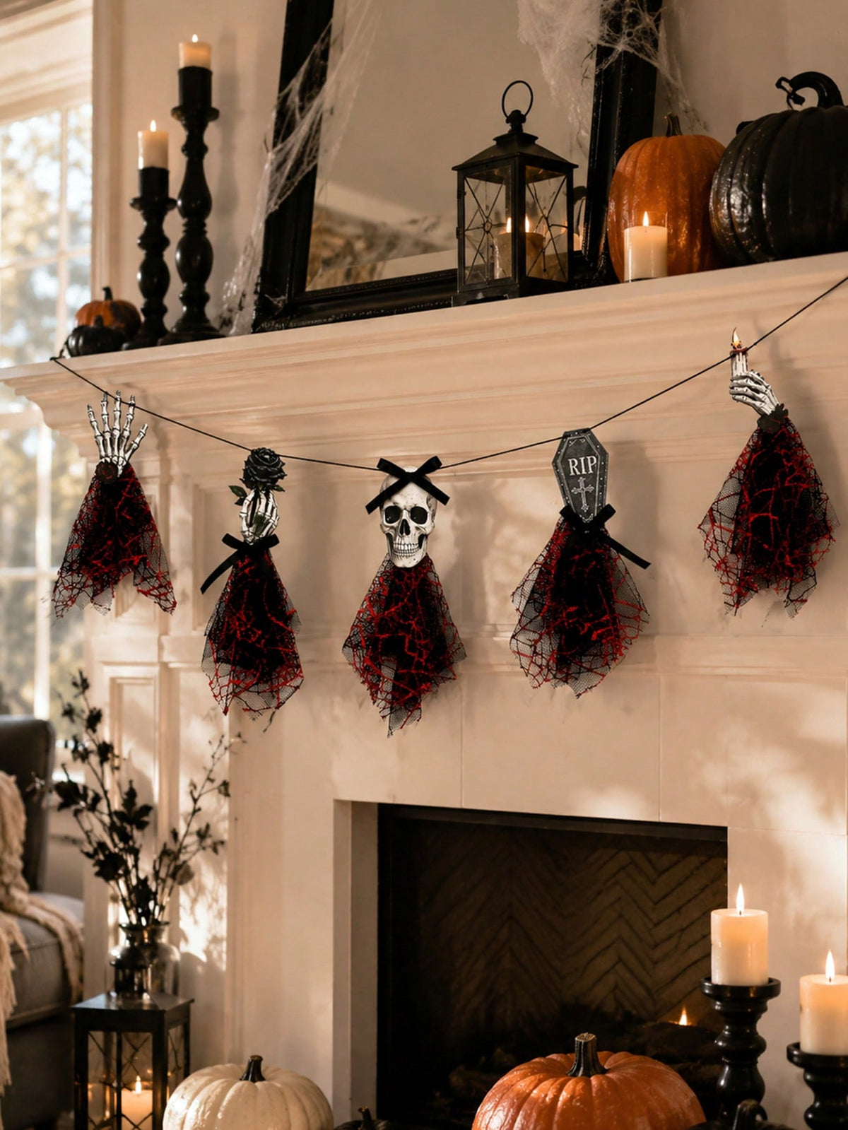 Gothic skeleton Halloween banner across a mantel with black candles