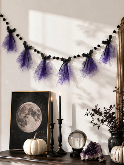 Purple bat Halloween banner on a wall above a table with moon print