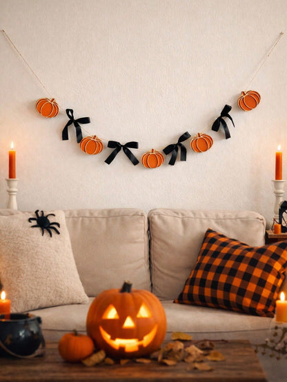 Pumpkin garland with black bows above a sofa