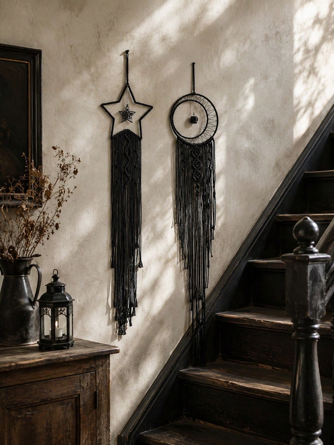 Black macrame moon dream catcher pair along a staircase
