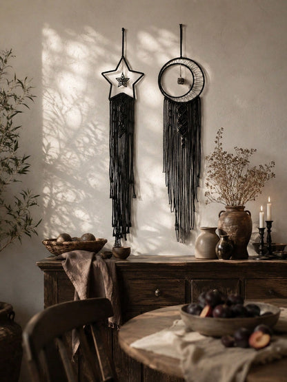 Black macrame moon dream catcher pair above a dining table