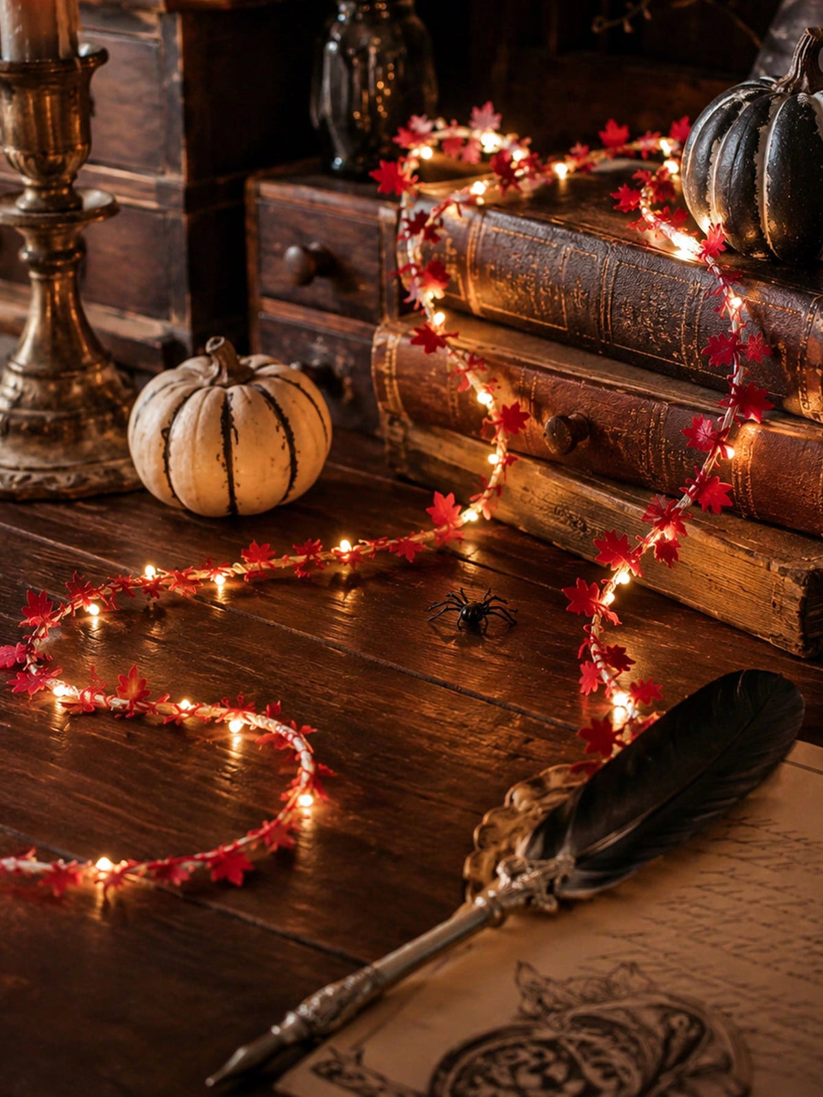 Maple leaf fairy string lights red, with a white pumpkin