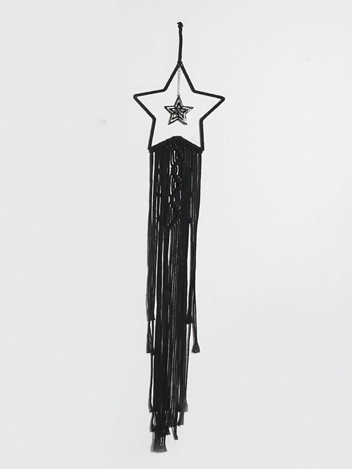 Black macrame moon dream catcher star style on white wall