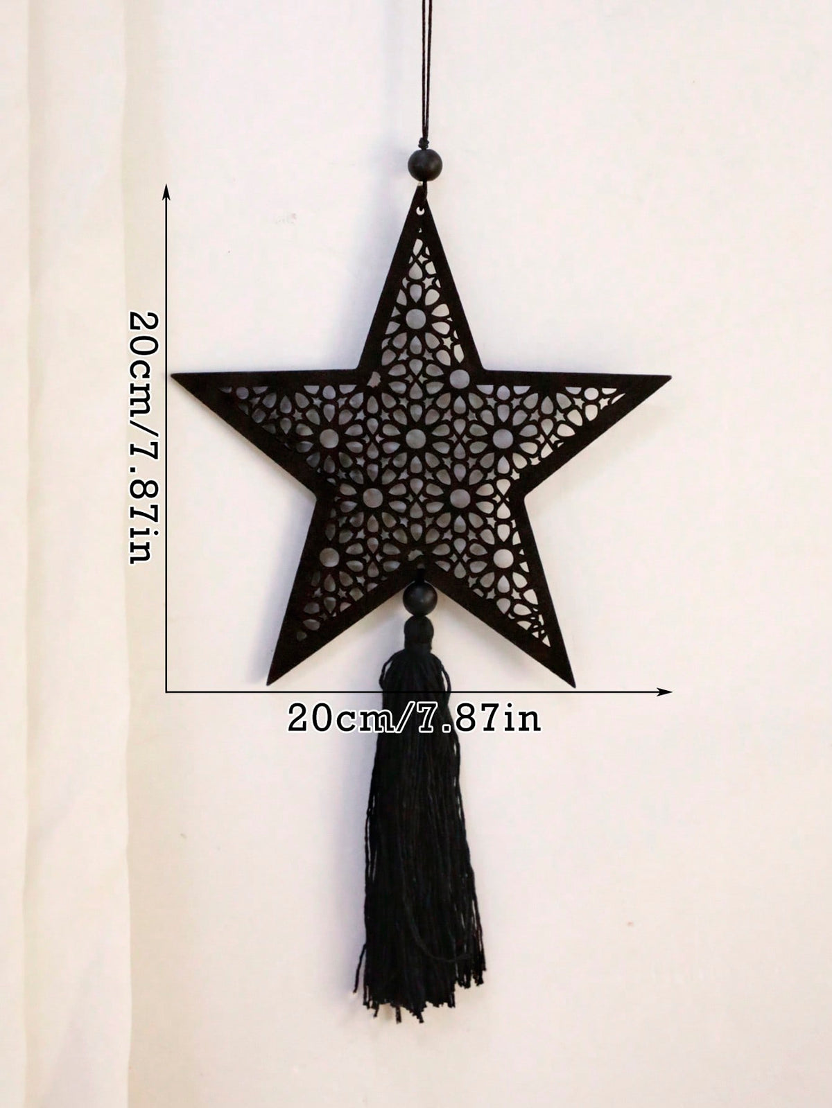 filigree star tassel wall hanging - product photo